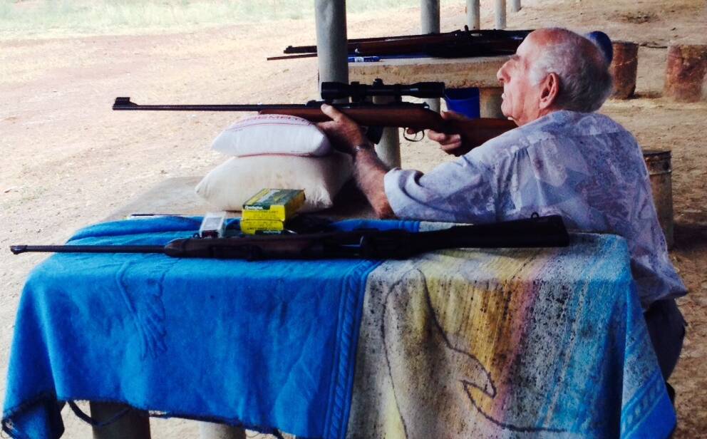 ANZAC SERVICE: Frank Koitka tries out a 22 Rimfire rifle during the Mount Isa Branch Sporting Shooters Association of Australia military competition in 2014. 
