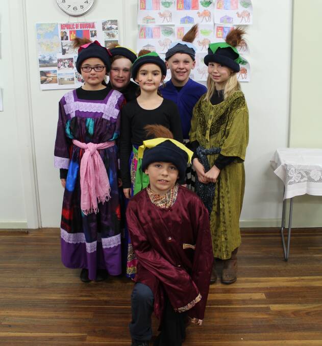 IN COSTUME: Ruby, Jeremy, Maddison, Daine,, Breanna and (front) Campbell in traditional Mongolian costume.