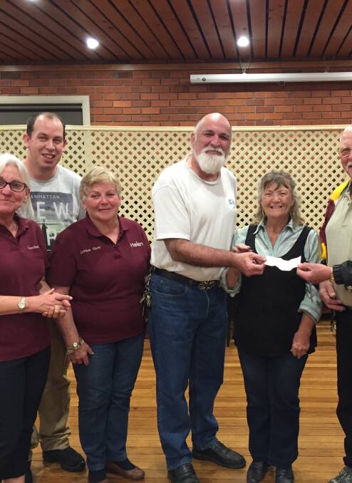 Linedancers: Wollemi Amigo’s present cheque to Men’s shed.