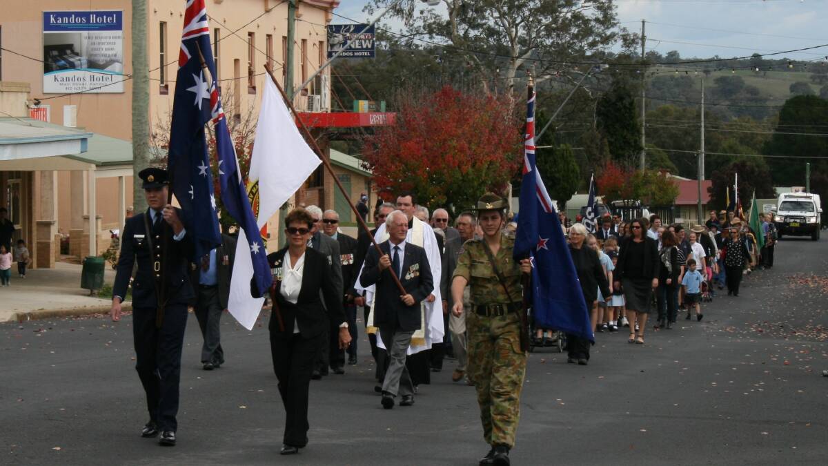 ​ Rylstone and Kandos: L-R Jayden Taylor, Lyn Rawlinson and Ms Campbell leading the ANZAC March.