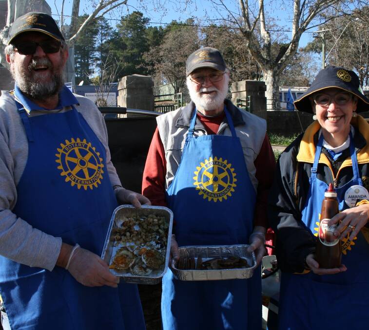 Serving with a smile: Rotary regulars serving up, David Roach, Graham Jose and Amanda Roach.
