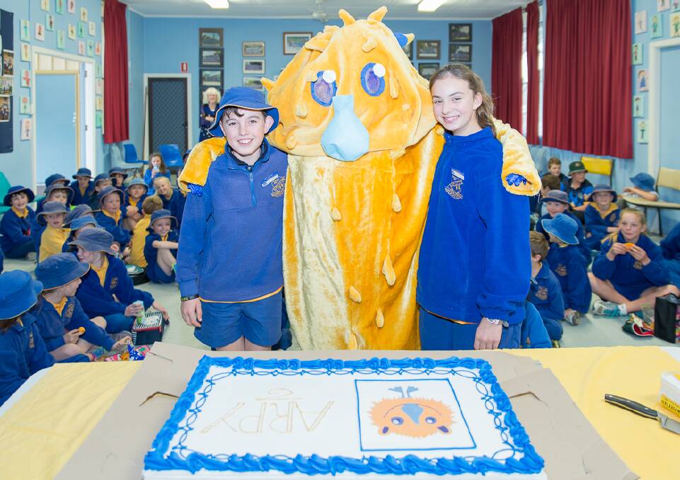 Cake Time: School captains Max Suttor and Chloe Mackander with ARPY and the huge cake made for the occasion.