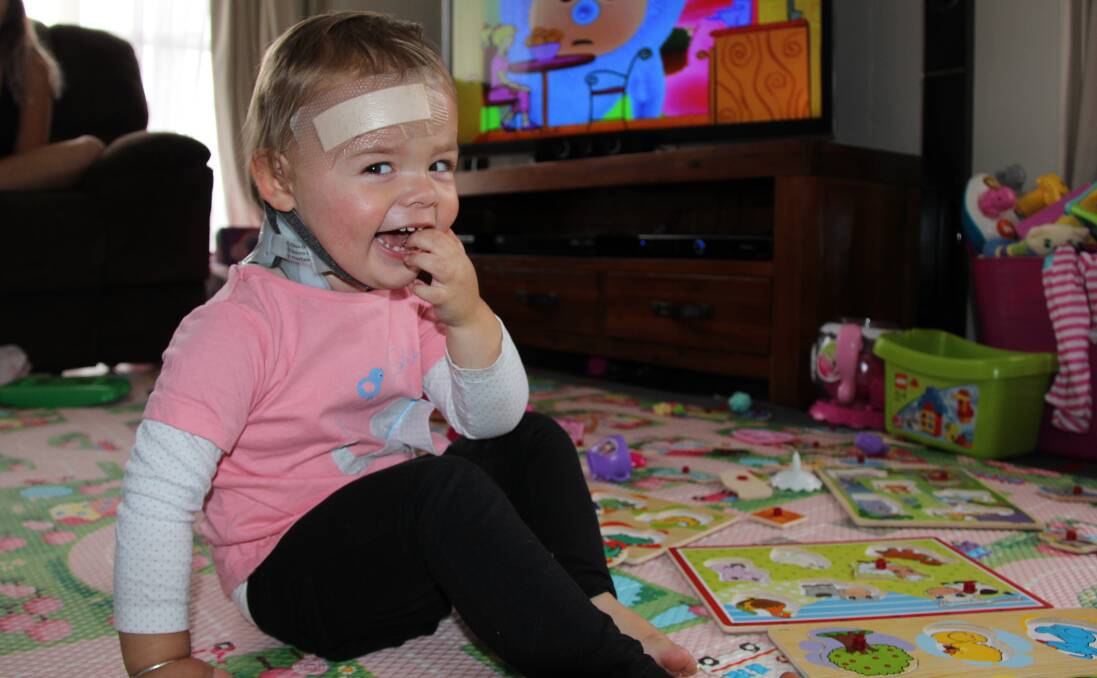 Four months after breaking her neck in a car accident Mudgee toddler Summer has had her three-kilogram halo removed and replaced with a neck collar until the neck muscles are strong enough to hold her head up.