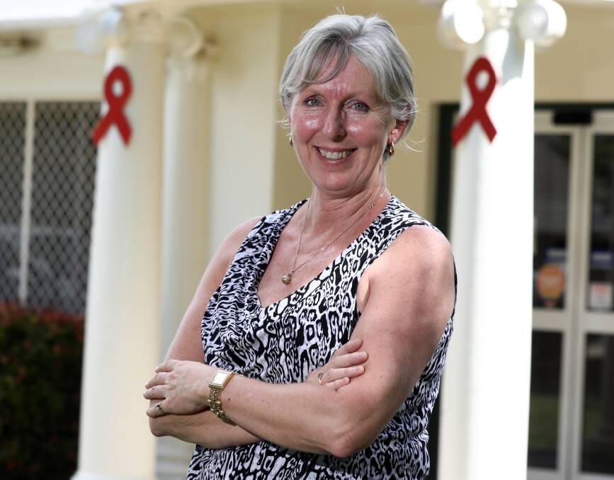 RED RIBBONS: Donna Middleton is the nursing unit manager at the Orange Sexual Health Unit and is promoting World AIDS Day on Friday. Photo: ANDREW MURRAY 1130amaids3