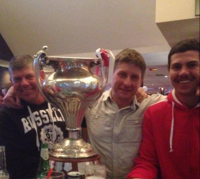 WINNER:  James and Zac Adams with Dragons coach Tony Pascoe (centre)  and the Group 10 premiership trophy. 