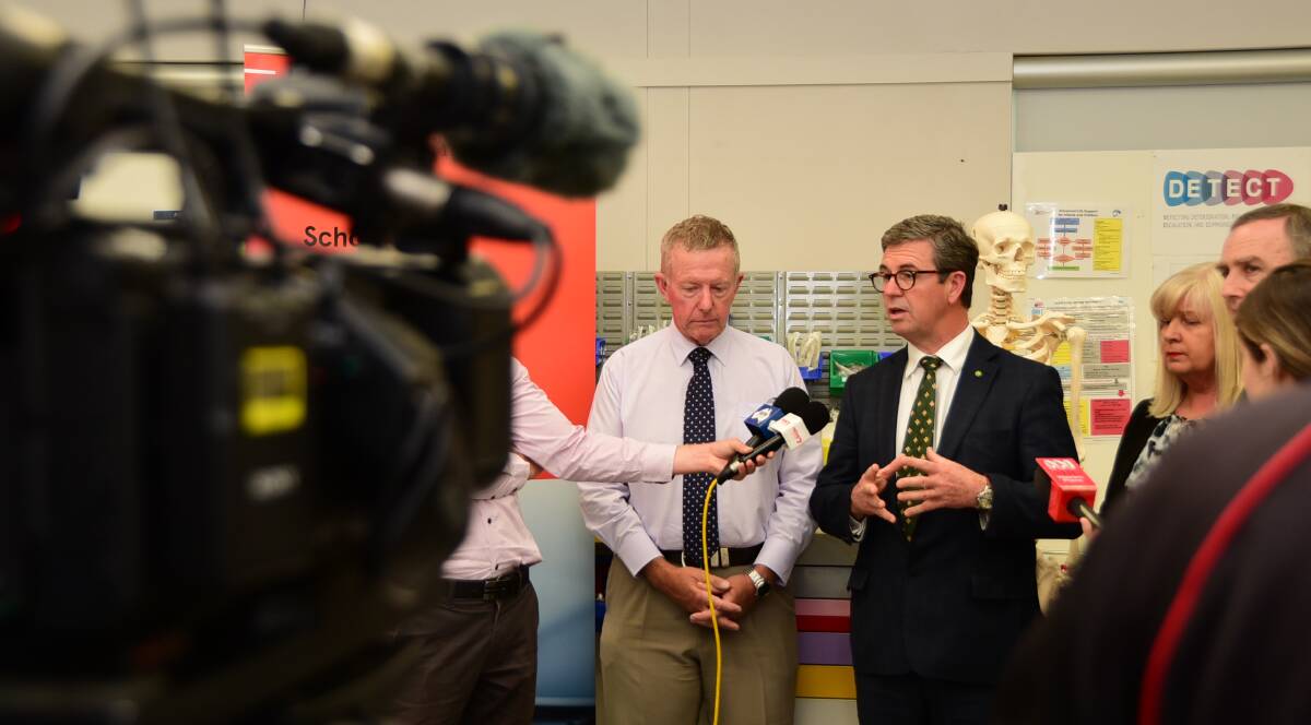 ROLLING: Mark Coulton flanks Dr David Gillespie at a media conference at the University of Sydney's School of Rural Health Dubbo campus. Photo: BELINDA SOOLE