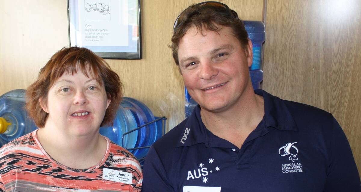 CHAMPION:  Former world rowing champion Ben Houlison with Jennie Blackman during his visit to Mudgee Recycling on Wednesday. 