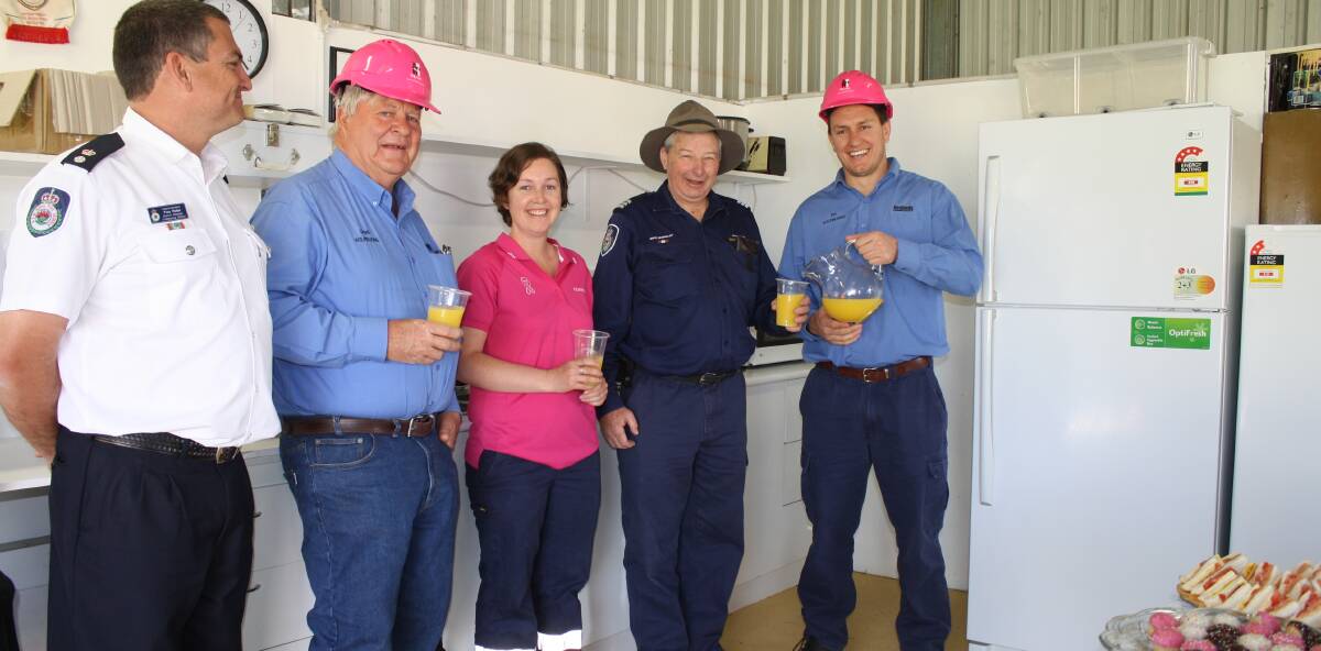 COOKING:  Cudgegong RFS district manager Troy Porter, Lloyd Coleman, Tara Stokes, Cooks Gap RFS captain Greg Dunnicliff and Ian Flood. 