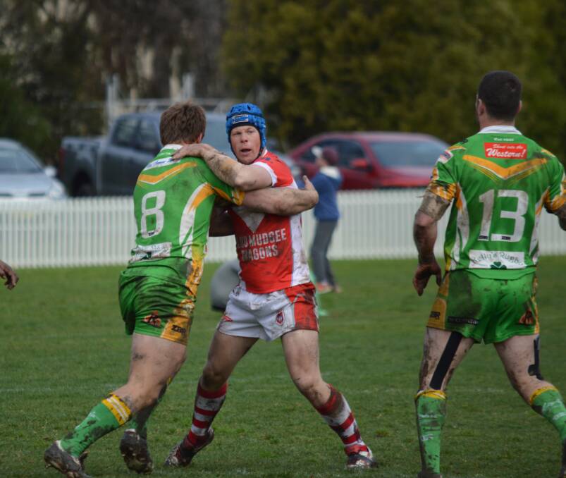DISAPPOINTED:   Dragons captain Jared Robinson (centre) praised his team for fighting to the end against Orange CYMS at Wade Park on Sunday. 