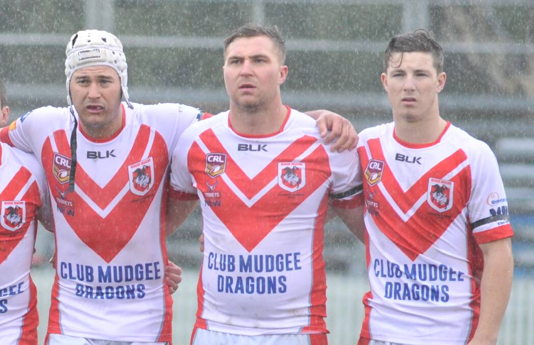 MAN OF THE MOMENT: Dave Scott Medalist Hamish Bryant (centre) was a one-man wrecking ball in an epic grand final at Wade Park. Photo: JUDE KEOGH