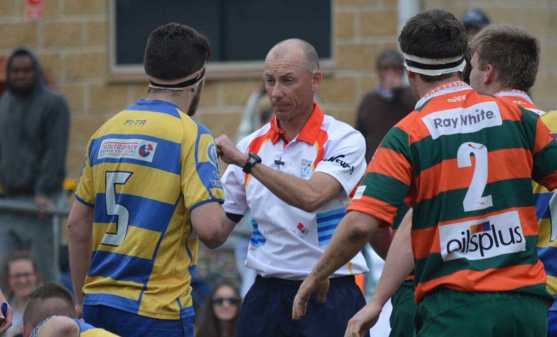 MAN IN CHARGE: Jarrod Simpson has a chat during the colts major semi-final a fortnight ago, he'll be refereeing the decider as well. Photo: MATT FINDLAY