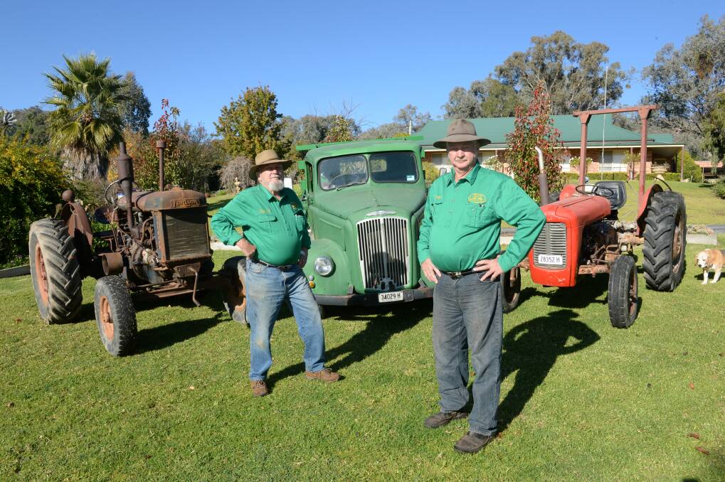 Back to the future: Cudgegong Valley Antique Machinery Club president Brian Jones and vice-president David Craig with tractors that will be on display during the field days. Photo: Rachael Webb