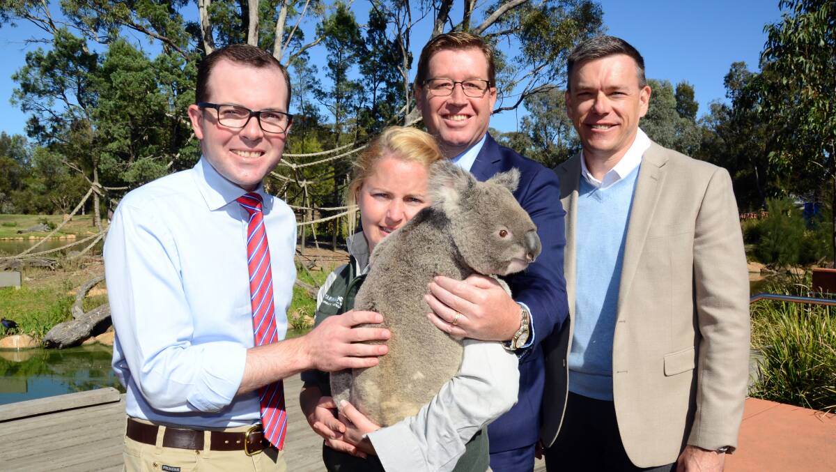COME HERE: Adam Marshall, Karen James, Luca the Koala, Troy Grant and Matt Fuller are encouraging international visitors to the zoo via a new campaign. Photo: BELINDA SOOLE