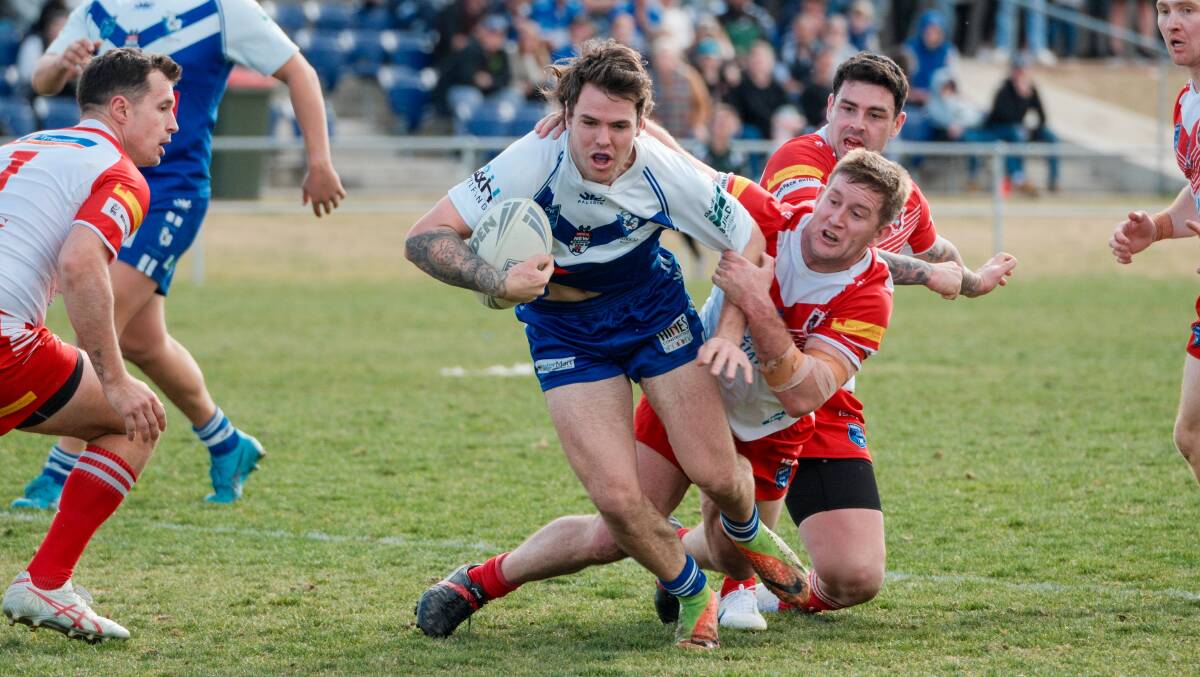Ash Cosgrove tries to evade a tackle in Sunday's game against Mudgee. Picture by James Arrow.
