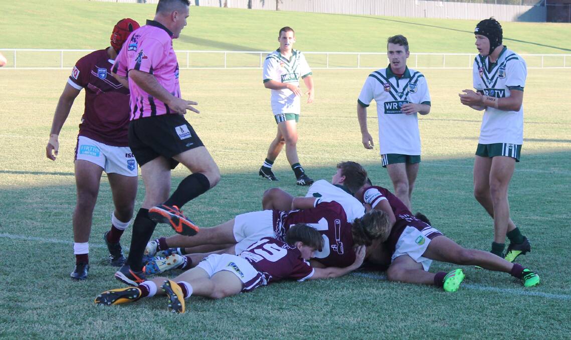 SO CLOSE: CYMS big bopper Jack Davis looks to the referee after going close to scoring on Saturday while fellow local talents Jackson Bonham-Phair and Matt Burton look on. Photo: PETER CLARKE/CRL