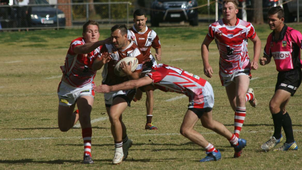 The Coolah defence attempts to stop Gilgandra's Jamie Towney during the 2017 Castlereagh League season. Picture supplied