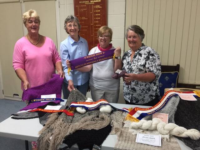 Annie Johnston (left) Robyn Northam, Janet deRooy and Barb Gow showing off their ribbons.