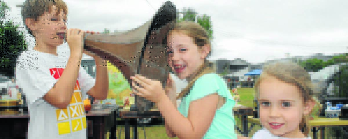 Oliver, Deanna, and Evie Yule have fun with an old gramophone at a previous Mudgee Swap Meet. The annual meet will return to the Mudgee Showground this weekend.