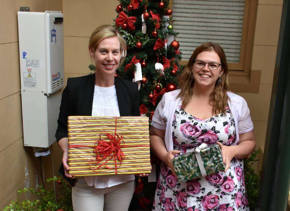 Kylie Manners and Amie Carrington from The Benevolent Society at the Cobb and Co Wishing Tree.