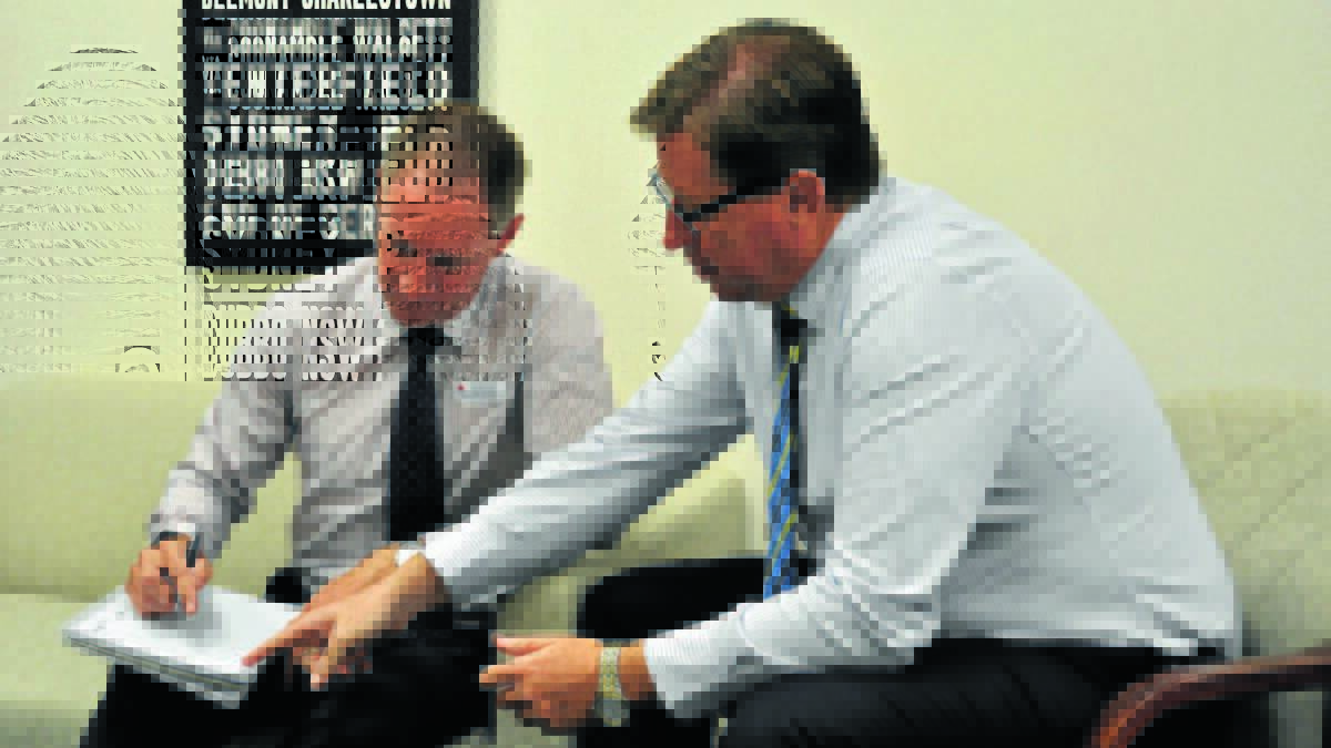 Western NSW Local Health District chief executive Scott McLachlan and Dubbo MP Troy Grant discussing plans for the $60 million redevelopment of Mudgee Hospital in February 2016.