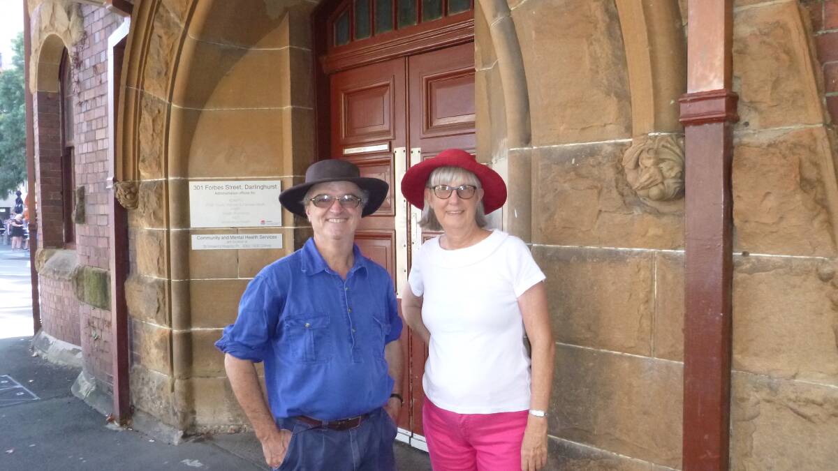 David Allworth and partner Heather Drew at the front doors of the former Darlinghurst Police Station where David came to bail out friends and co-workers arrested at the first Gay Mardi Gras in 1978. Photo: supplied