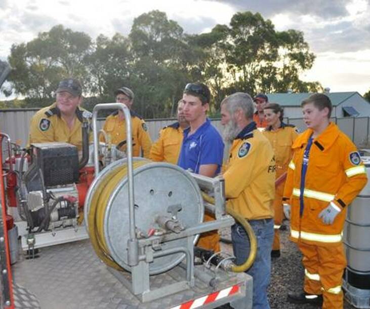 RFS: Brigade Captain Noel Taylor and Mudgee Senior Deputy Captain Keegan Midson showing training participants how to operate the Category 1 heavy tankers.