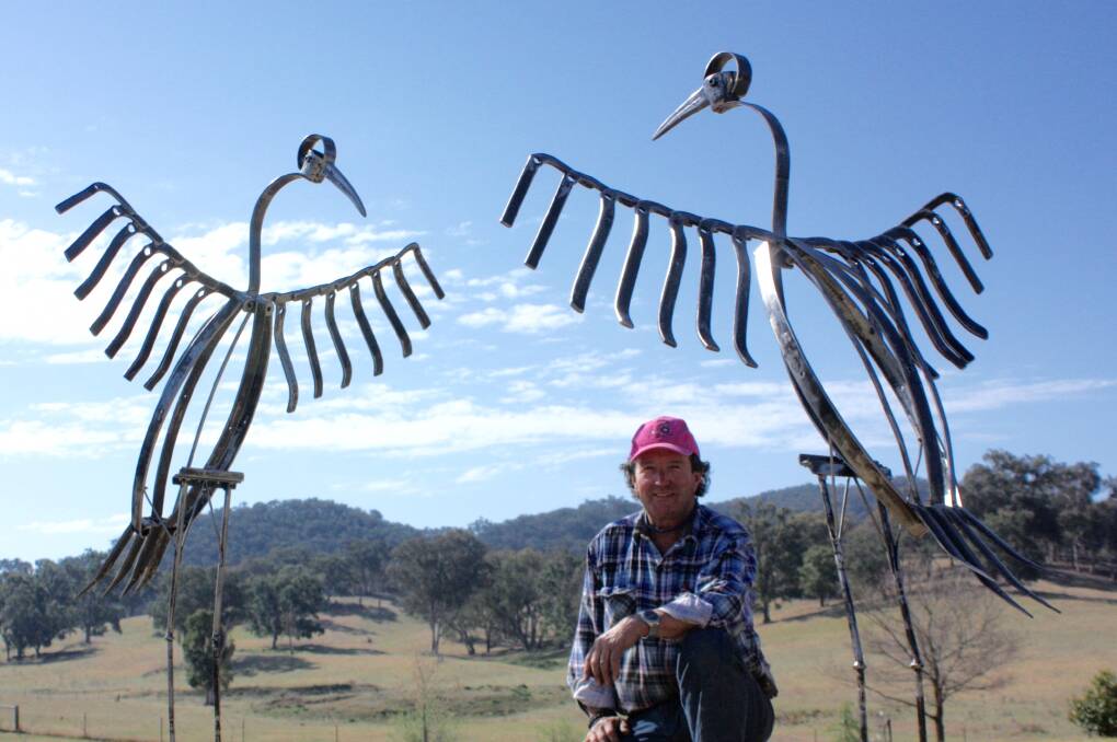 ART: Mudgee sculptor Richard Nagel  with the 'Dancing Brolgas'. Photo: supplied.