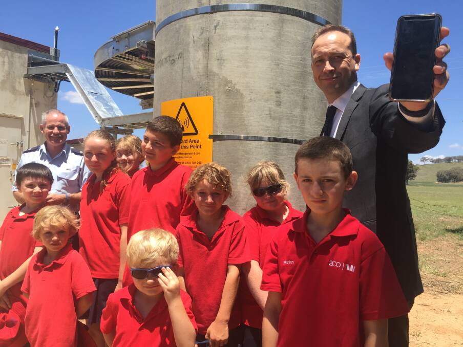 SWITCHED ON: Telstra Country Wide Western NSW area general manager Scott Curtin and Goolma Public School students welcomed the Goolma Telstra tower on Tuesday. Photo: Honor Elliott