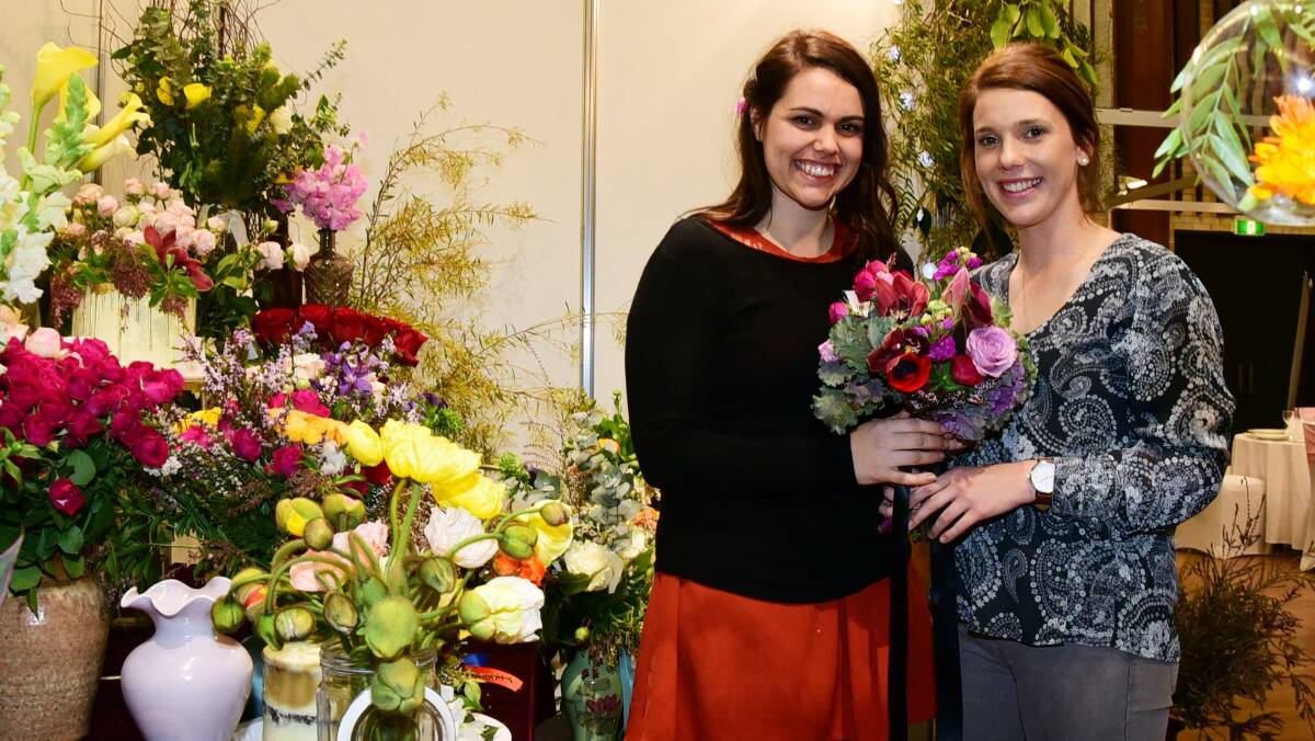 Bouquets for brides: Irissa Knight from The Meadow - Floral Design discusses blooms with Emily Clow at the 2016 Dubbo Bridal and Event Expo. Ms Knight will be at the 2017 expo. Photo: BELINDA SOOLE 