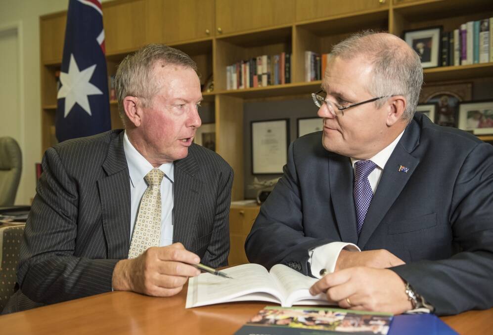 Parkes MP Mark Coulton and Treasurer Scott Morrison discuss the federal budget. Photo: CONTRIBUTED