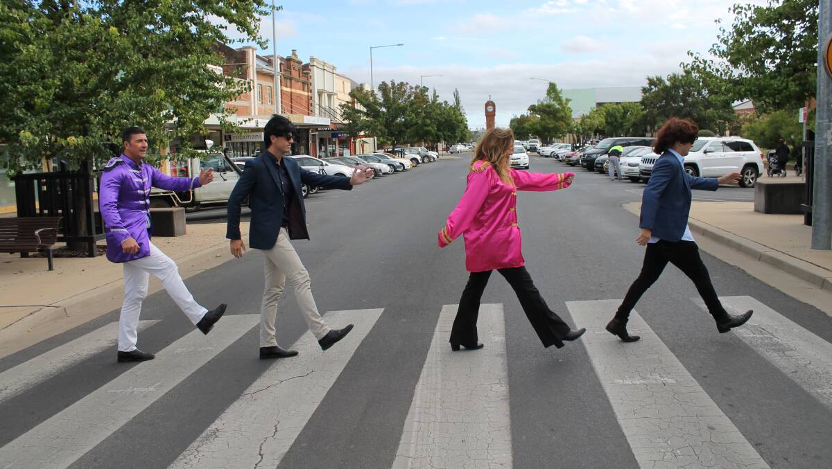 COME TOGETHER: Parklands Resort's Jason Cooley, Mitchell Gunn, Kellie Gant, and Lachlan Willis, replicate the Beatles' famous Abbey Road album cover in anticipation of the upcoming Beatlemania on Tour show.