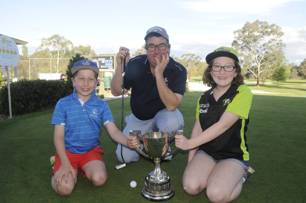 BRINGING IT HOME: Bathurst Golf Open winner Mark Hale, pictured with son James and daughter Jasmine. Photo: CHRIS SEABROOK