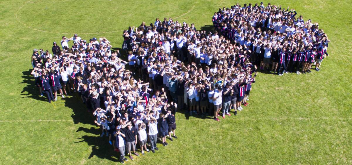 BIG NUMBER: The students of Mudgee High mark the centenary of the school on Friday in this photo snapped by Amber Hooper using a drone. 