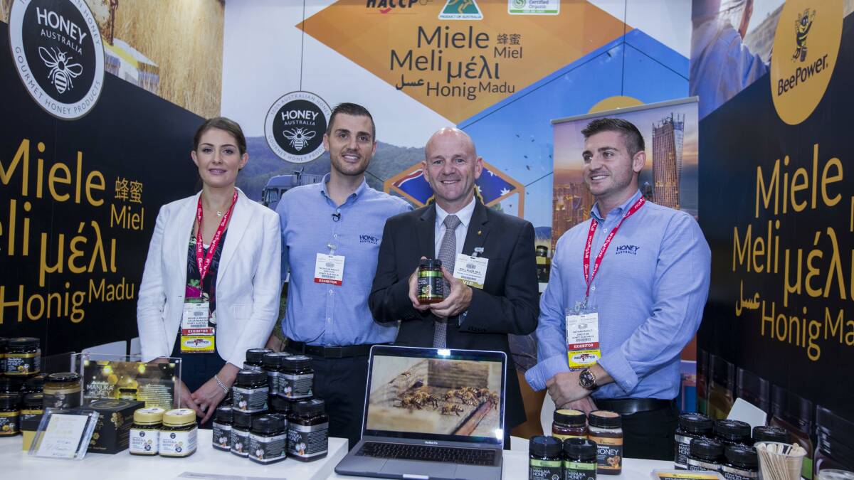 BIG STAGE: Michela, Nicholas and Nathan Maiolo of Mudgee's Honey Australia, with NSW Minister for Primary Industries Niall Blair, at Gulfood in Dubai – the world’s biggest food trade show.