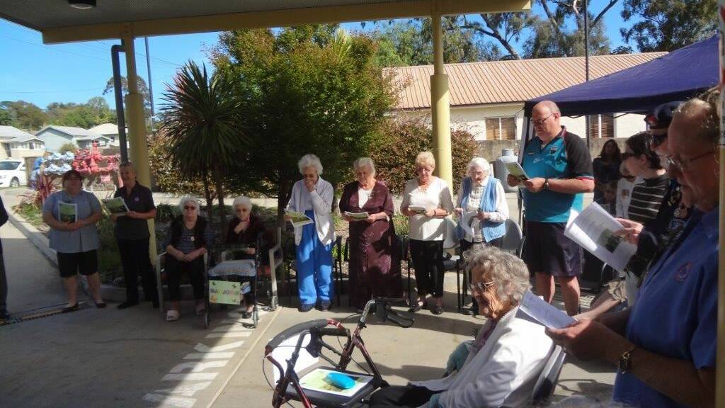 Residents, relatives and staff from ADA Cottage during the service.
