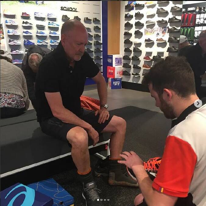 FIT OUT: David Cox tries on shoes for his fundraising walk from Sydney to Dubbo, which will pass through the Mudgee region.