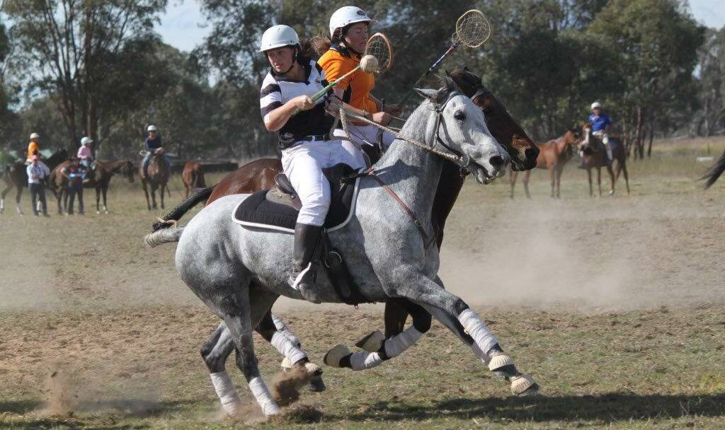 Nicole Hill playing for Gulgong on 'Denim' against Quirindi in the Women's A Grade final of the Gulgong Polocrosse carnival on Sunday.