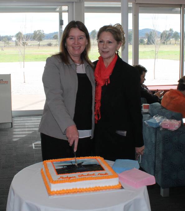 TAKES THE CAKE: Mudgee College team leader Samantha Cosgrove and TAFE Western manager of Student Hubs Donna Polak at the morning tea for the new facility.