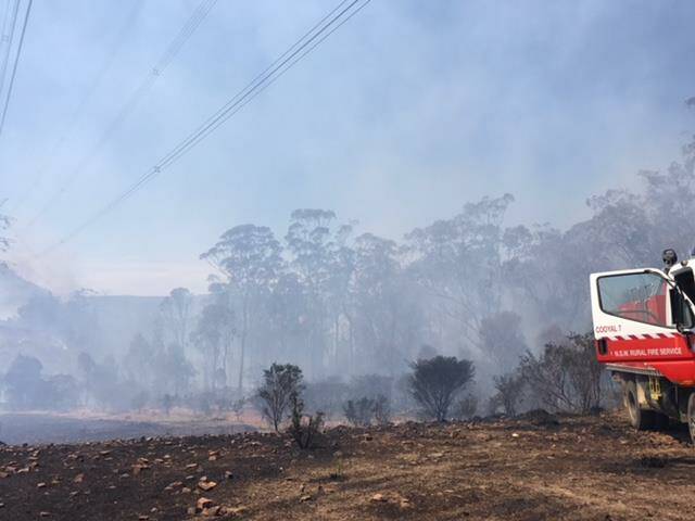 Firefighters on the scene of a fire east of Wollar Village, photo from NSW RFS.