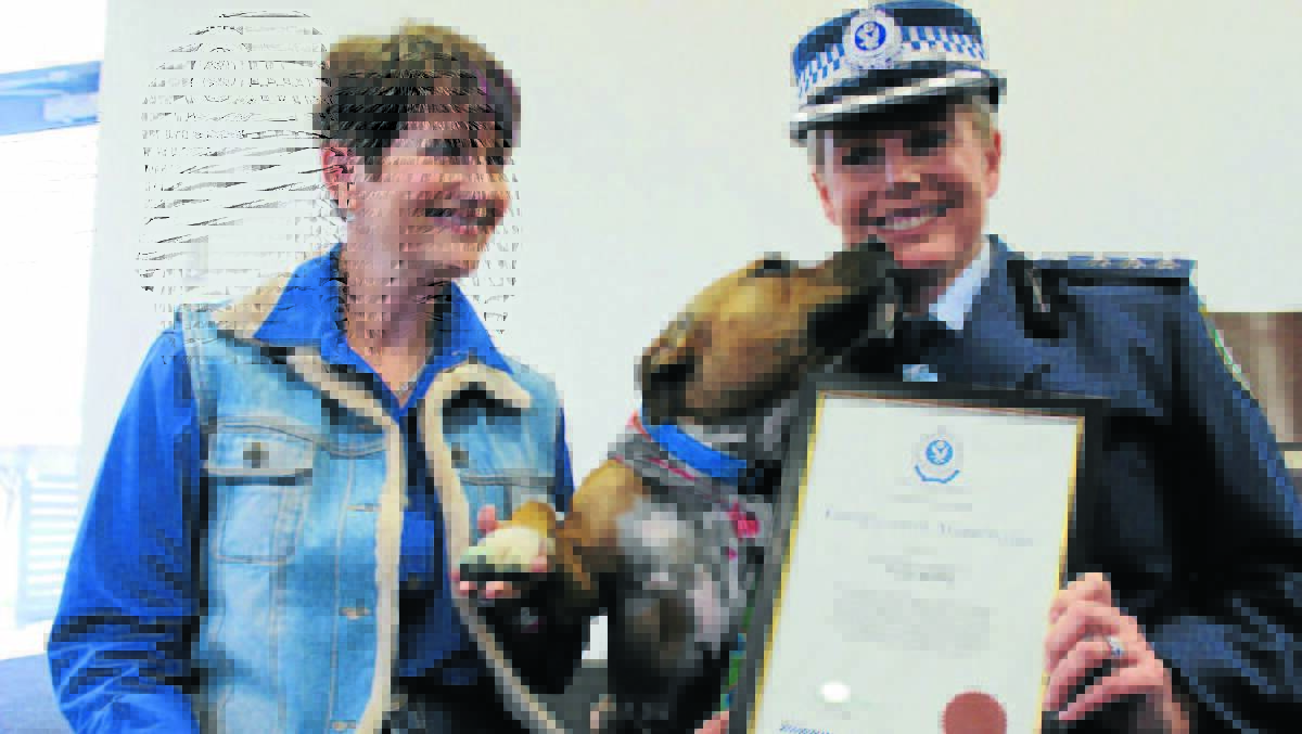 Buster was honoured by Mudgee Local Area Command in 2014, he is pictured with owner Donna Hartley and then Acting Superintendent Julie Boon.