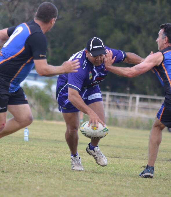 WRAPPED UP: Mudgee's Brett Paulson playing for the Mudcrabs against Nelson Bay in the Men's 40s division of the NSW Country Championships held in Wollongong on the weekend.