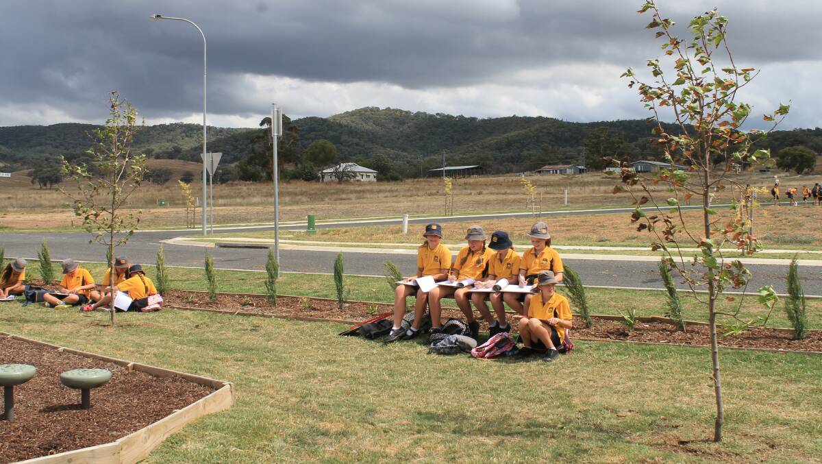 THE DRAWING BOARD: Mudgee Public School students sketching the developed and undeveloped areas of Caerleon.