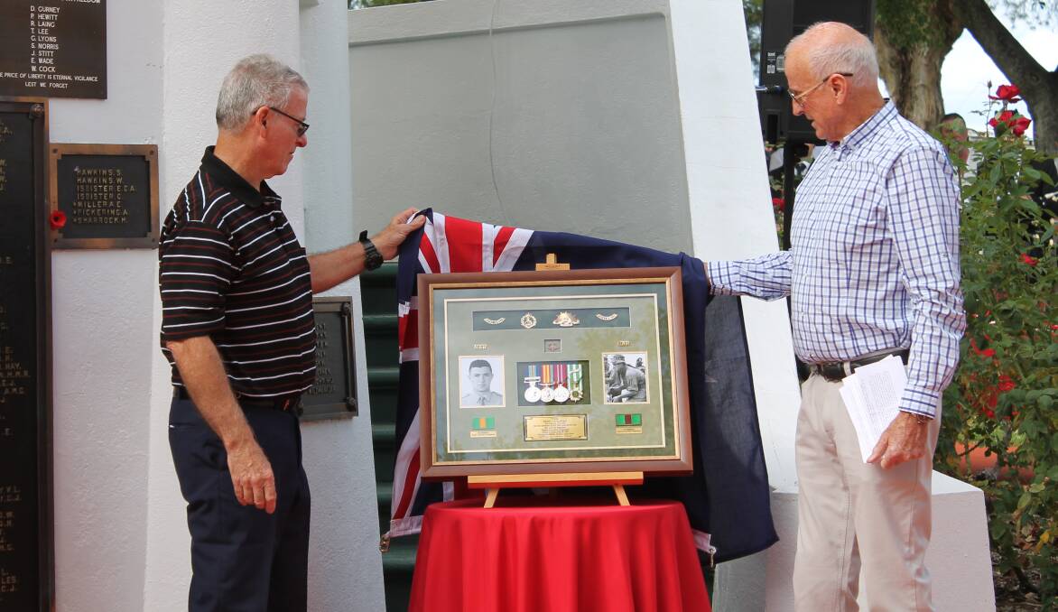 TRIBUTE: Kevin and Jim Brophy unveil the tribute to their late brother Edward.