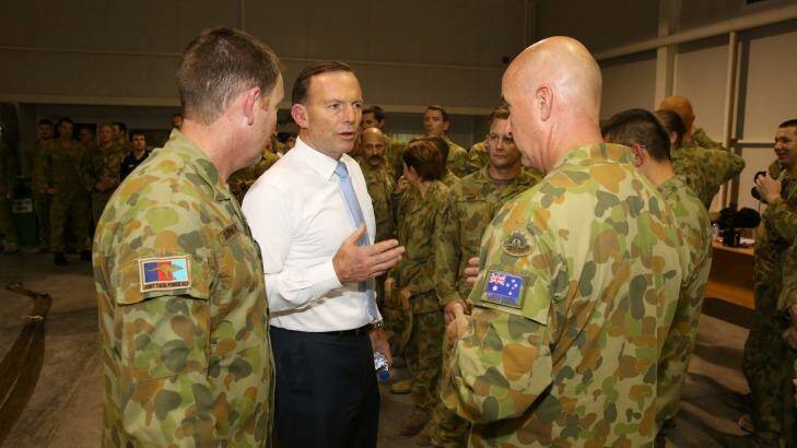 Prime Minister Tony Abbott at Al Minhad in the UAE. He has hosed down claims an Australian C-130 was shot at while on an aid drop in northern Iraq. Photo: Supplied