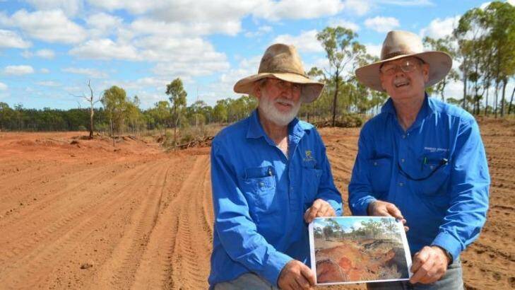 Beef producer David Nicholas (left), pictured with Queensland Agriculture Department officer Bob Shepherd at a gully rehabilitation project on his property, fears he will lose his farm, which has been in the family since 1963. Photo: North Queensland Register