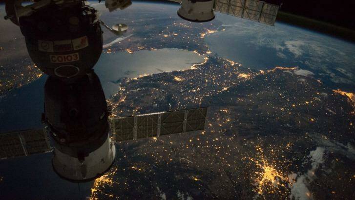 The International Space Station camera captures a nighttime view of the Strait of Gibraltar with a Russian Soyuz spacecraft (left) and Progress spacecraft in the foreground. You can see the lights of Madrid and Barcelona bottom of frame with Rabat and Casablanca towards the top. Photo: ISS/NASA