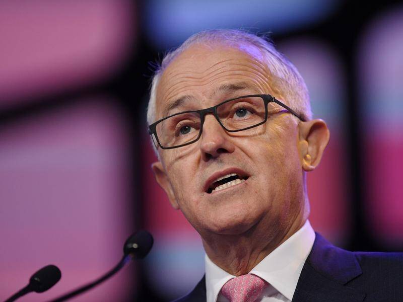 Malcolm Turnbull has used a business summit to slam political opponents over his planned tax cuts.