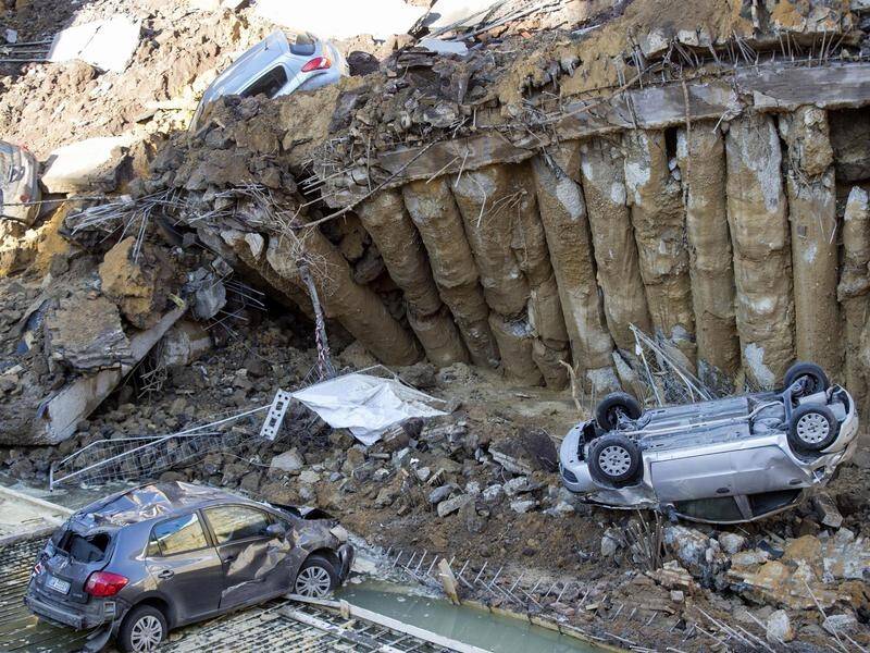 A giant sinkhole that swallowed up a half-dozen cars in Rome will be investigated.