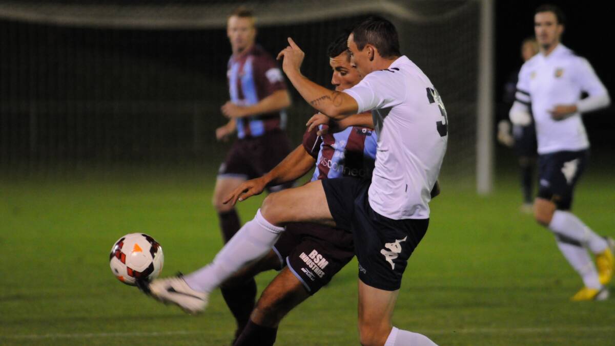 OPENS: Western Mariners' Nathan Davis challenges for possession. Photo: JUDE KEOGH