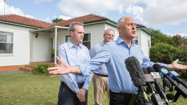 Prime Minister Malcolm Turnbull, Treasurer Scott Morrison and local member David Coleman visit a home in Penthurst in 2017 to talk about negative gearing. Photo: Michele Mossop

